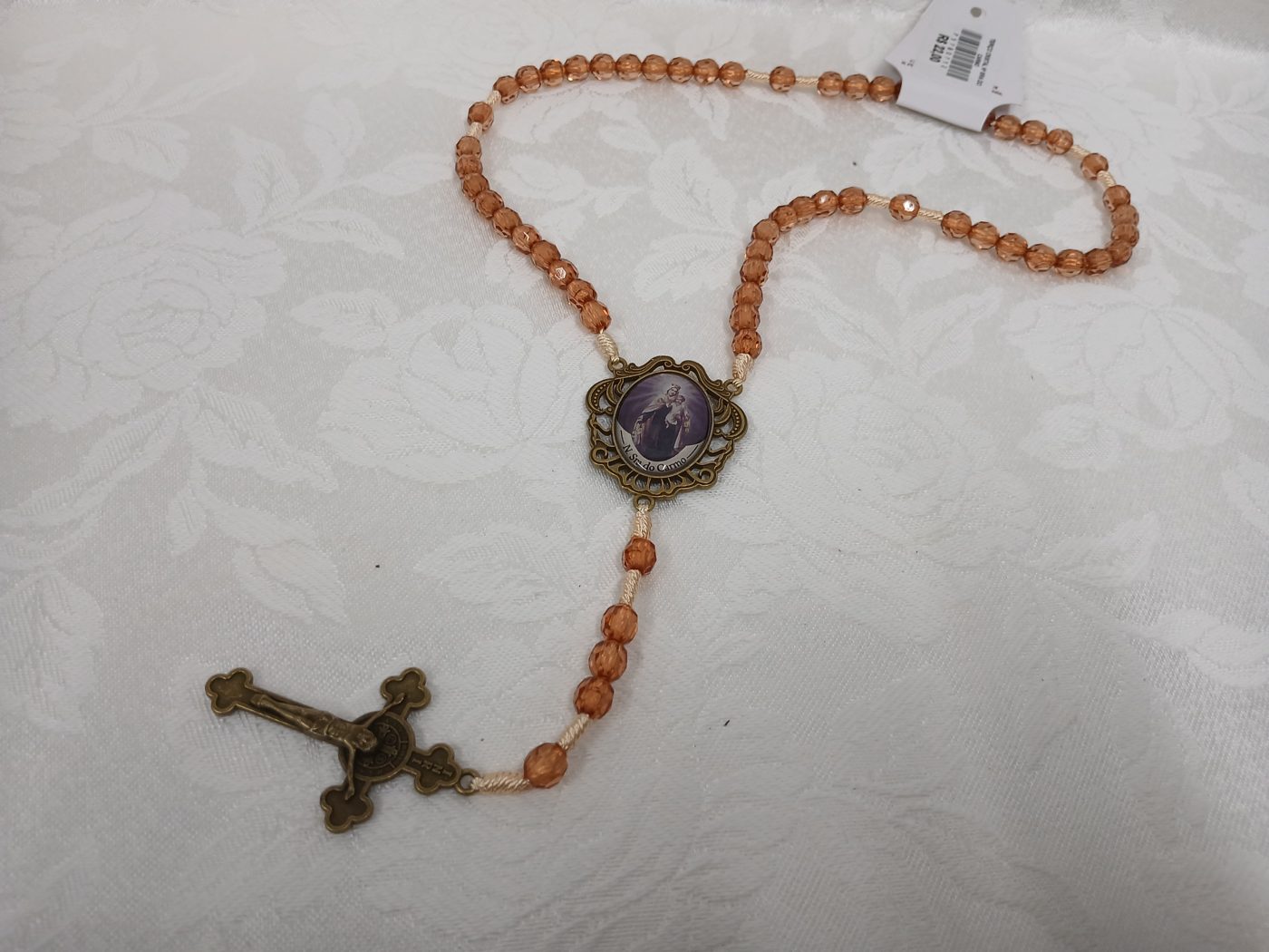 Terço âmbar com medalha ornamentada